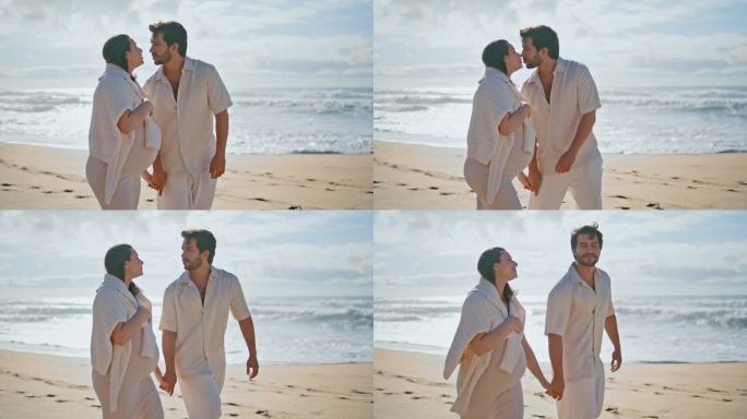 一对浪漫的夫妇在海边漫步，期待着孩子的降生。怀孕的配偶走路