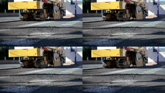 压路机正在修筑一条新的柏油路。道路维修。开辟新路。高质量的全高清镜头
