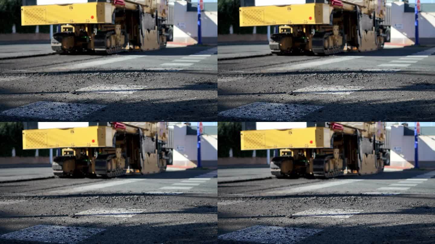 压路机正在修筑一条新的柏油路。道路维修。开辟新路。高质量的全高清镜头