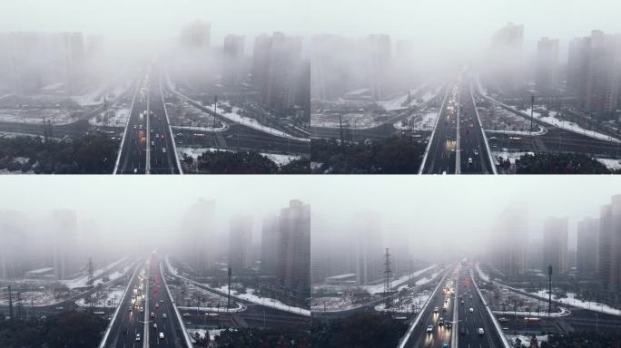 下雪天的立交桥晚高峰车流航拍烟雾迷绕