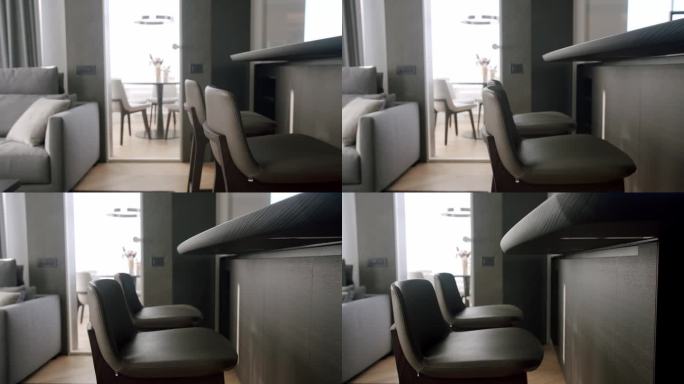 酒吧凳，极简主义室内的现代灰色家具，透明门