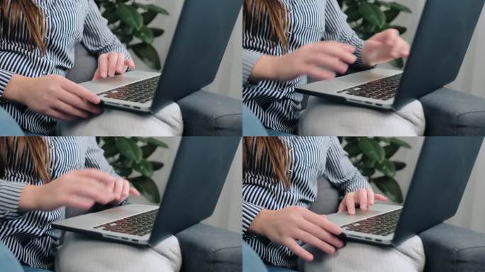 女性在现代个人电脑键盘上打字的手特写。不知名的年轻白人女商人坐在家里办公室舒适的沙发上写电子邮件。经