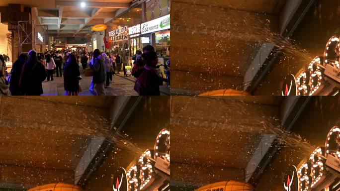 一群人在酒吧门口感受下雪氛围，人造雪