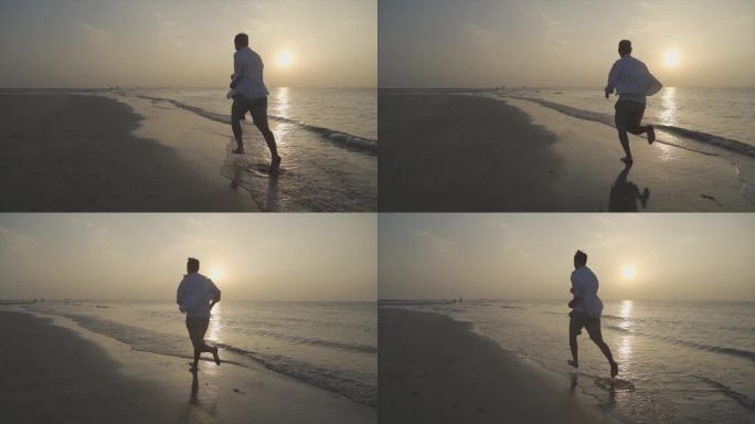 阳光少年男人逆光奔跑沙滩跑步背影追逐梦想