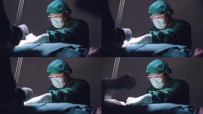在昏暗的手术室里，一名外科医生在他的团队的帮助下，表情严肃地为病人做手术缝合。