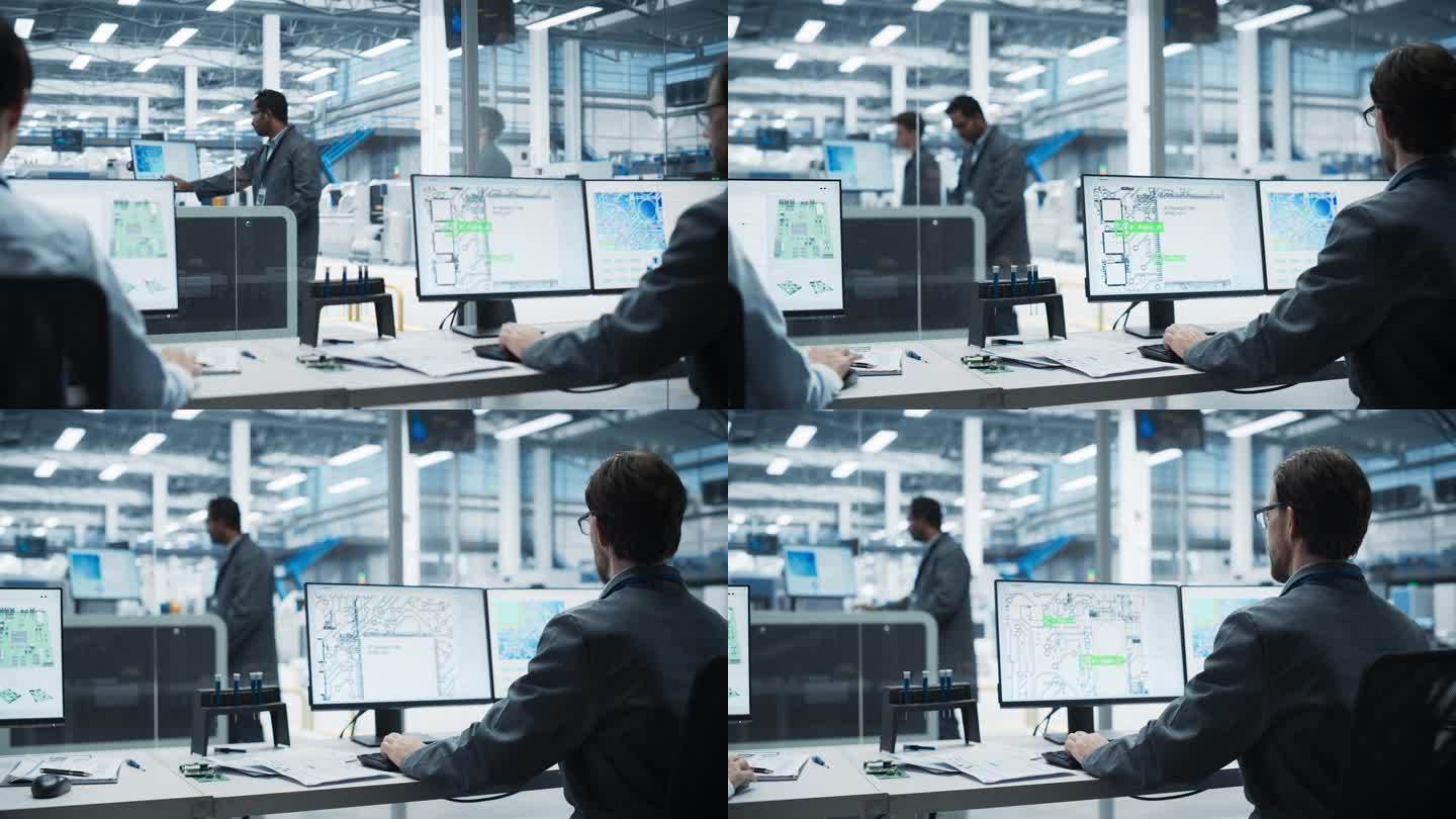 电子工厂办公室:亚洲和高加索男性工程师使用台式电脑为功能强大的设备设计主板的背影，而印度同事使用焊接