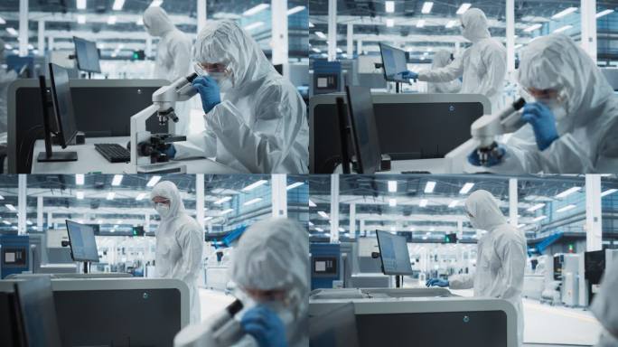 两位科学家在研究工厂的无菌套房:工程师使用显微镜和台式电脑检查微芯片，而他的同事使用焊接喷墨打印机打