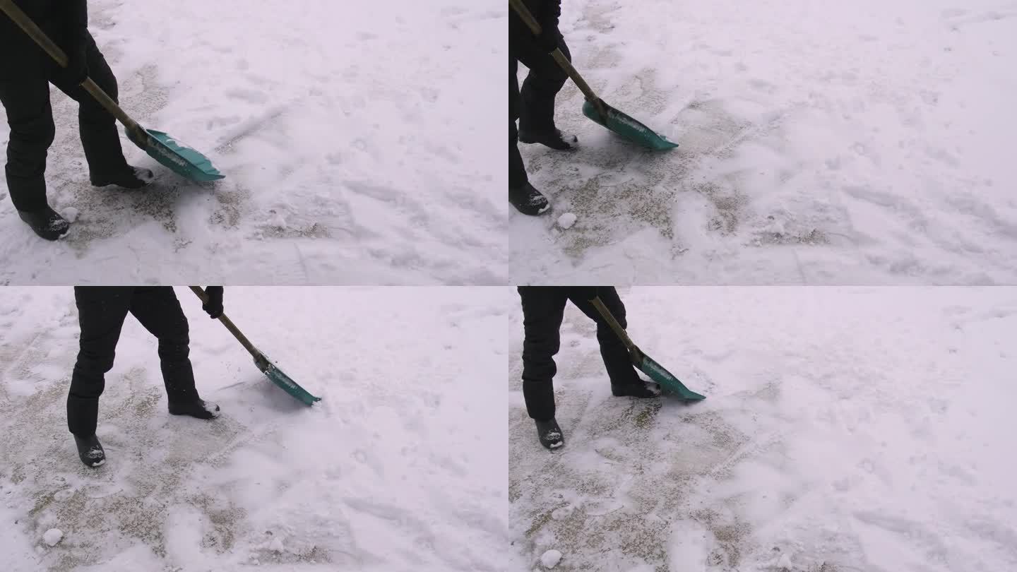 一个人在用铲子清理积雪。有选择性的重点。大自然。