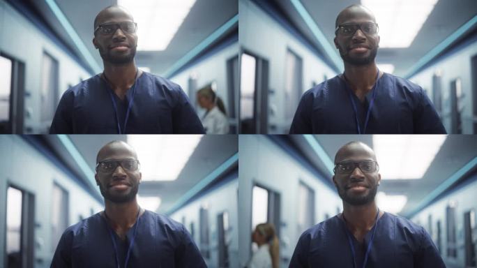 一名黑人医疗保健专业人员在诊所走廊摆姿势，微笑着看着镜头。戴眼镜的医生在医院工作，拯救生命