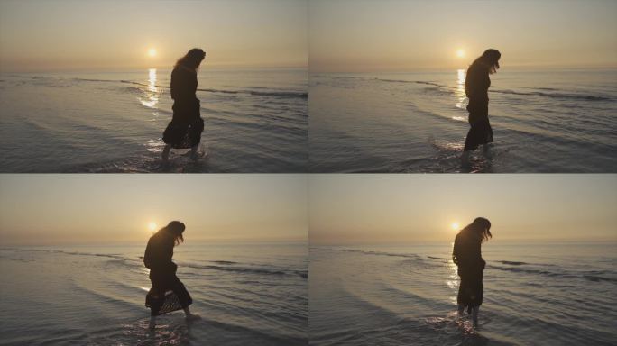 唯美女生海边剪影逆光人物背影沙滩慢步夕阳