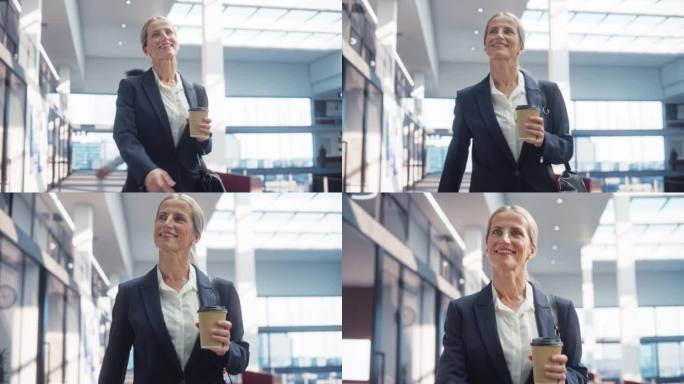 一个自信的女商人在明亮的商业大楼里走向办公室的肖像:一个成功的女经理以积极的态度在早上走向她的办公桌