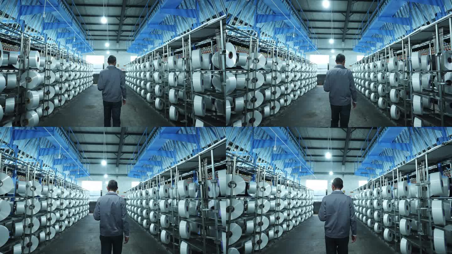男工人平板电脑在化纤厂纺织厂生产车间
