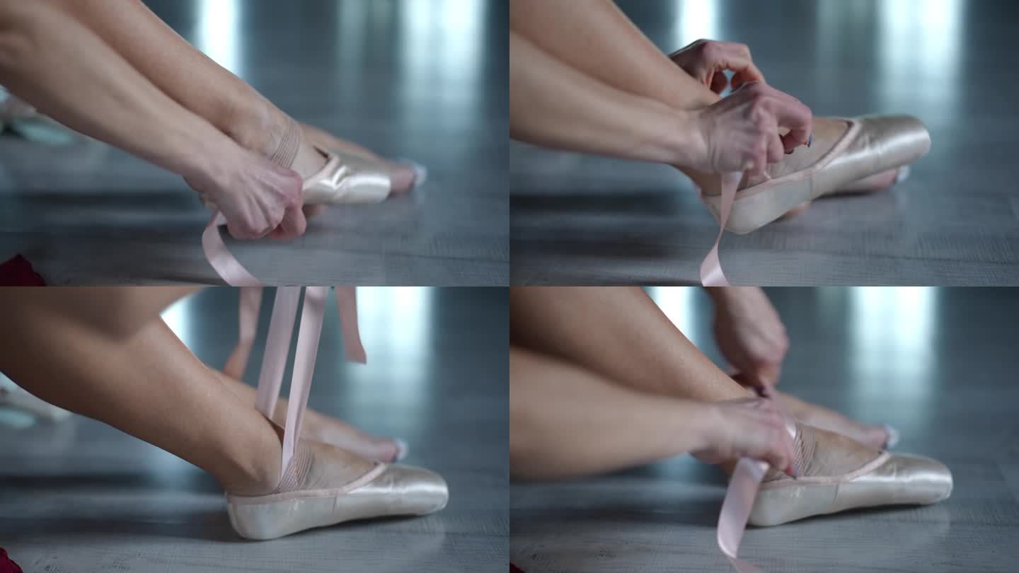 特写镜头。芭蕾舞女演员穿上芭蕾舞鞋——尖头鞋，坐在编舞大厅的木地板上。