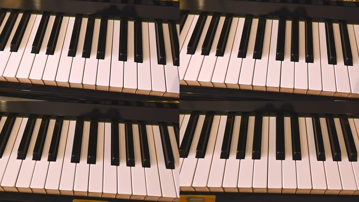 选择性地关注象牙色和黑色的钢琴键。大钢琴。俯视