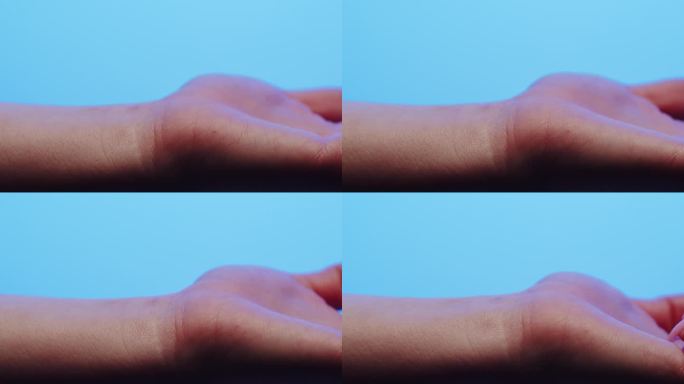 手部皮肤在蓝色霓虹灯下，制作人体部位、手臂表面的x射线微距拍摄。