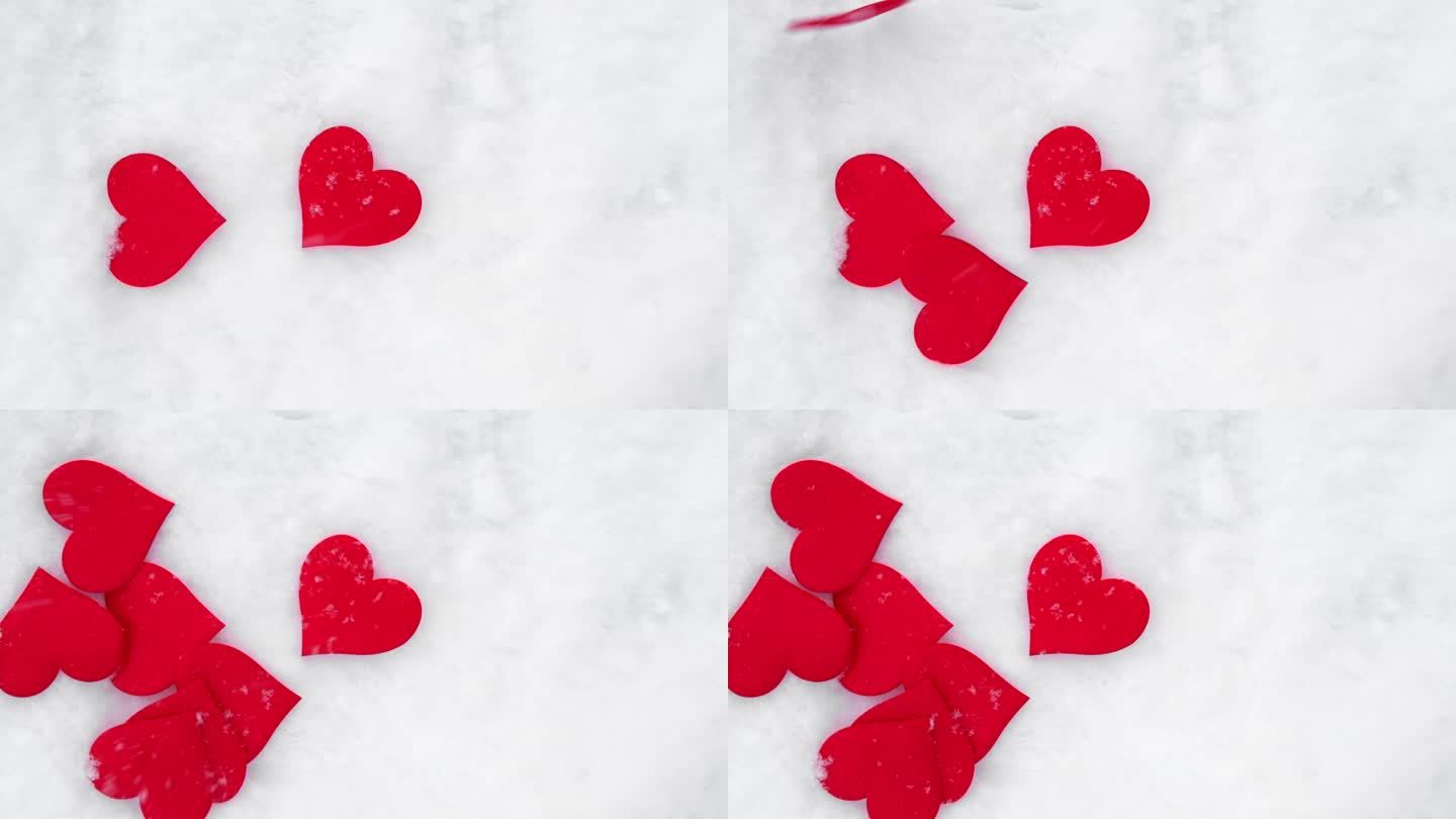 情人节的背景。红心落在纯白柔软的雪面上。象征着冬日节日里的爱情。浪漫的户外概念情人节复制空间。俯视图