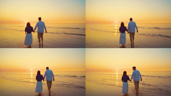 唯美浪漫情侣海边牵手看夕阳沙滩慢步谈恋爱