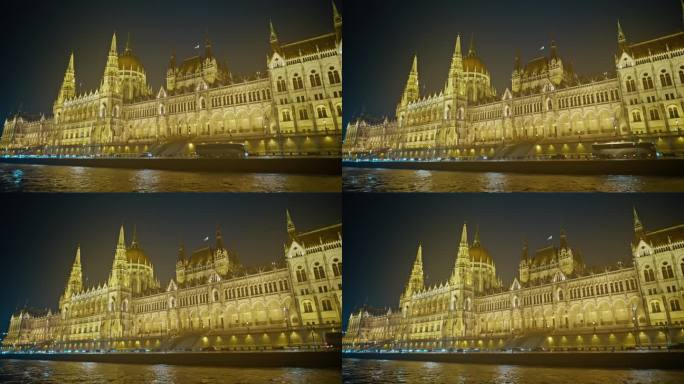 匈牙利，布达佩斯，夜间，从船的低角度看，被照亮的匈牙利议会大厦正对着天空