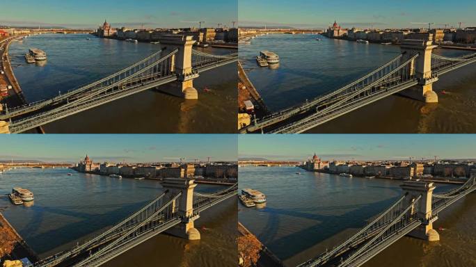 在阳光明媚的日子里，匈牙利布达佩斯城市景观中多瑙河上的sz<s:1> chenyi链桥的空中无人机镜