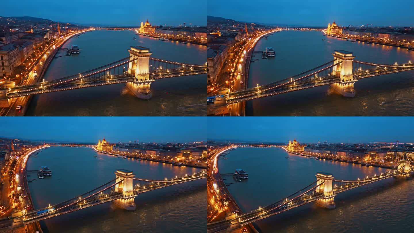 空中无人机拍摄照亮sz<s:1> chenyi链桥在多瑙河与匈牙利议会大厦黄昏在布达佩斯，匈牙利