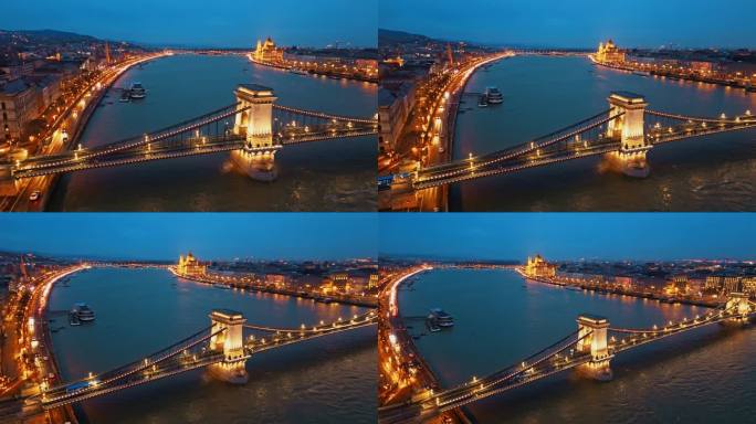 空中无人机拍摄照亮sz<s:1> chenyi链桥在多瑙河与匈牙利议会大厦黄昏在布达佩斯，匈牙利