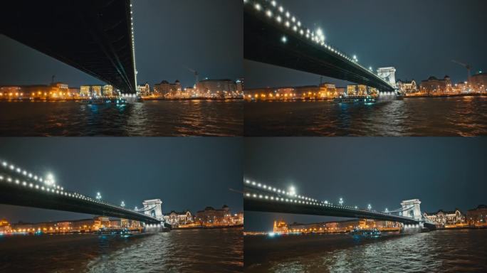 匈牙利布达佩斯，多瑙河上明亮的sz<s:1> chenyi链桥上的船景