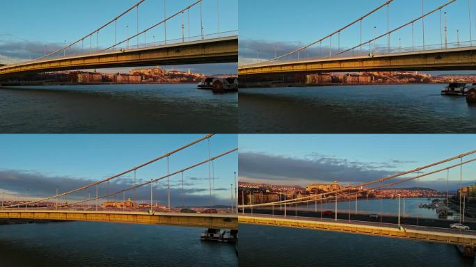 无人机拍摄的汽车在多瑙河上的伊丽莎白桥上行驶，日落时分，匈牙利布达佩斯