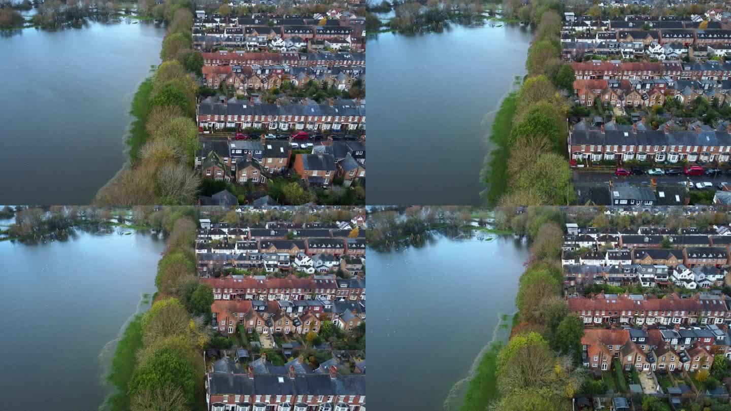 英国乡村被淹的田地和决堤的河水旁边的房屋