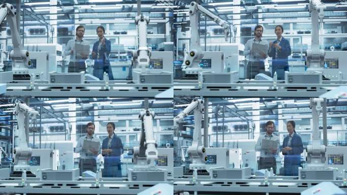 年轻的工程师和亚洲技术人员用笔记本电脑交谈。专家监控、分析现代化电子工厂的自动化装配线条件