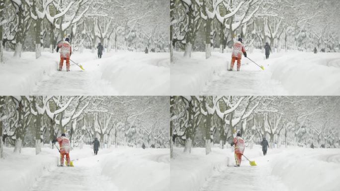 环卫工人在大雪中清理积雪