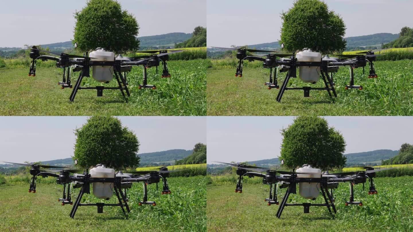 带有喷雾系统的农业无人机准备从绿色农场起飞