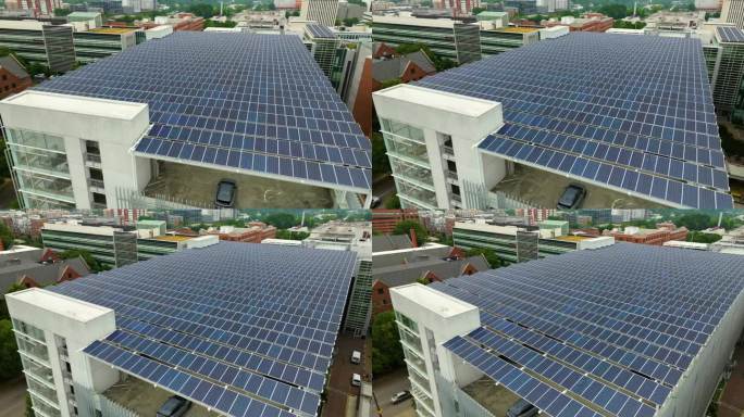 太阳能电池板安装在停车场的遮阳屋顶上，以有效地产生清洁电力。光伏技术融入城市基础设施