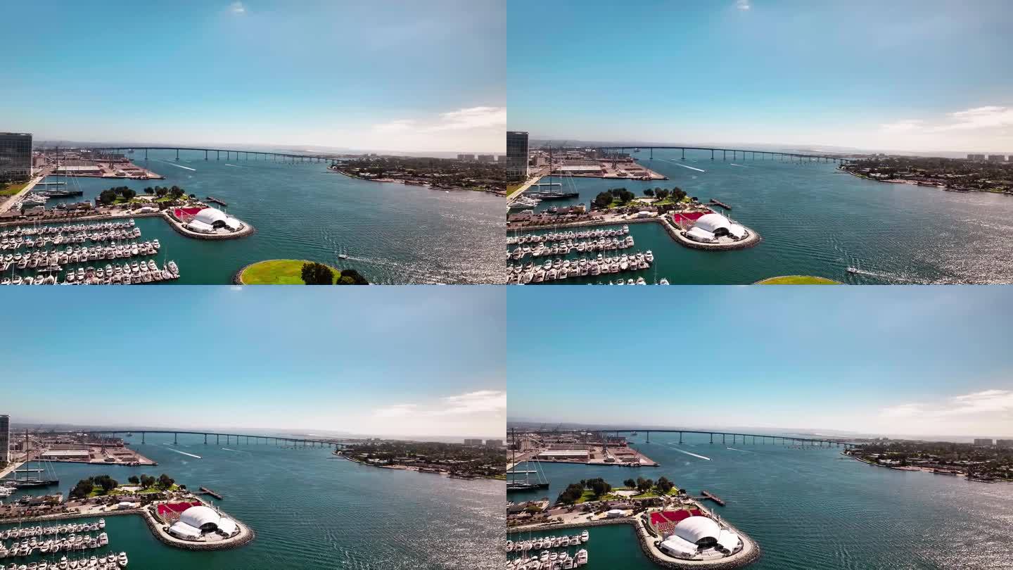 从高空俯瞰雷迪贝壳号和圣地亚哥科罗纳多大桥，海港里有很多船只。
