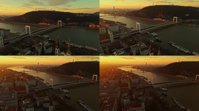 无人机镜头的伊丽莎白桥在多瑙河上的城市景观日落期间在布达佩斯，匈牙利