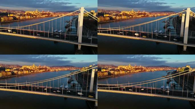 无人机拍摄的汽车行驶在多瑙河上的伊丽莎白桥在日落期间在布达佩斯，匈牙利