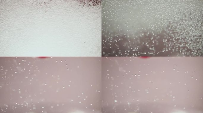 一个微距视频显示蔓越莓在水中飞溅。