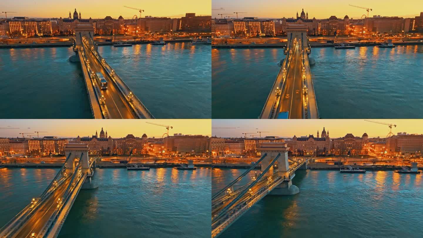 在匈牙利布达佩斯的多瑙河上，以历史建筑为背景的sz<s:1> chenyi链桥的航拍镜头