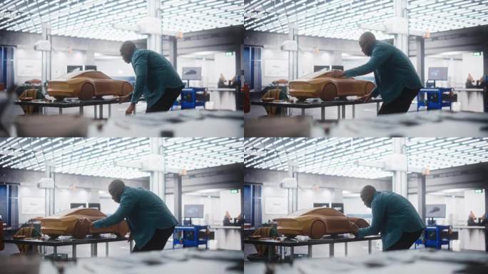 非洲汽车设计师用抹刀用聚合物模型粘土制作汽车原型。在一家汽车生产厂的研究和开发工作室工作的重点黑人建