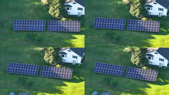 用于产生清洁生态电能的太阳能电池板安装在后院地面的独立框架上。自主住宅的概念