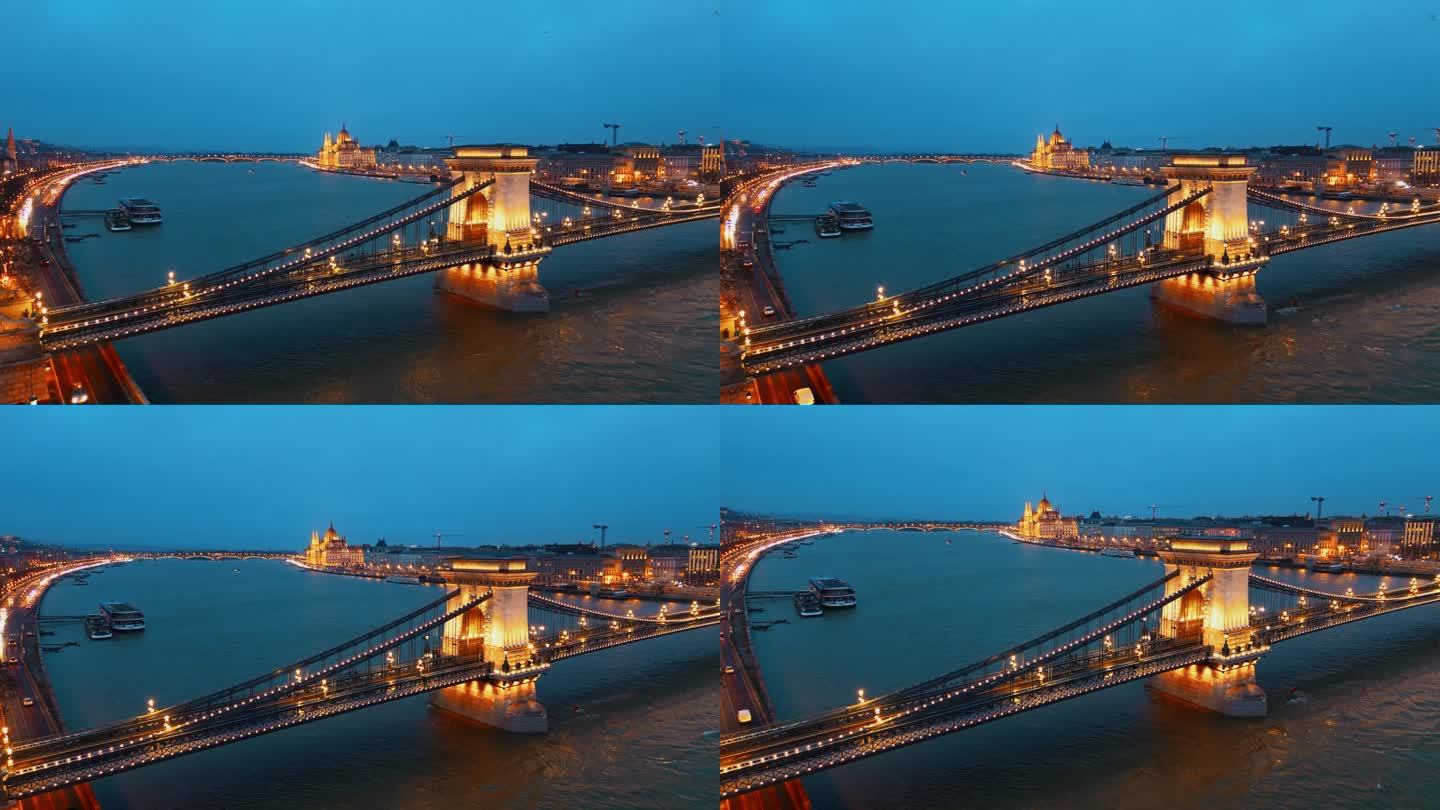 匈牙利布达佩斯多瑙河上被照亮的sz<s:1> chenyi链桥的慢动作无人机拍摄