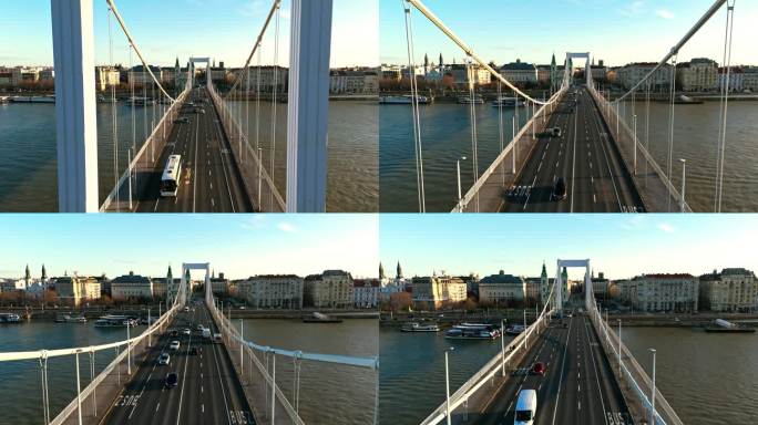 无人机拍摄的车辆在多瑙河上的伊丽莎白桥上行驶，拍摄于匈牙利布达佩斯的城市景观