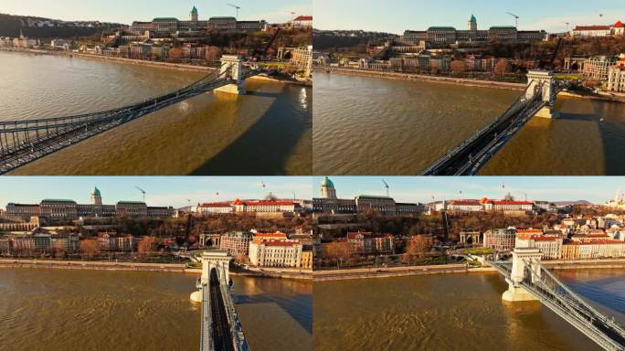 在阳光明媚的日子里，匈牙利布达佩斯拥挤的城市景观中，无人机拍摄的多瑙河上的szenjochenyi链