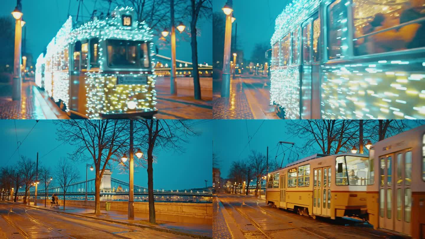 手持拍摄的照明装饰有轨电车在城市街道上移动与sz<s:1> chenyi链桥背景在布达佩斯，匈牙利的