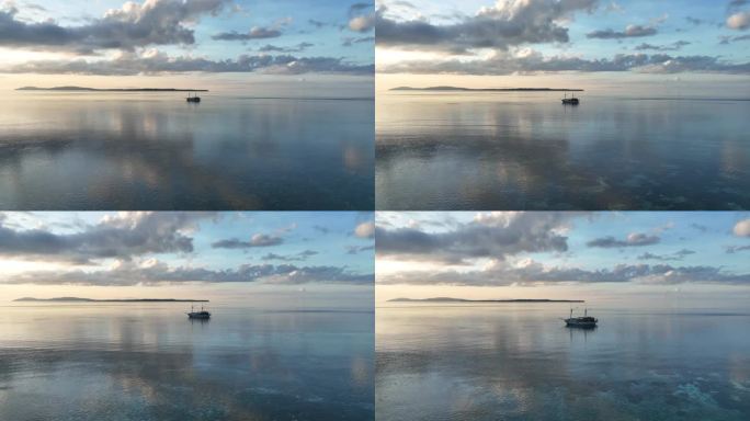 华丽的日出，平静的大海和菲尼西纵帆船的航拍