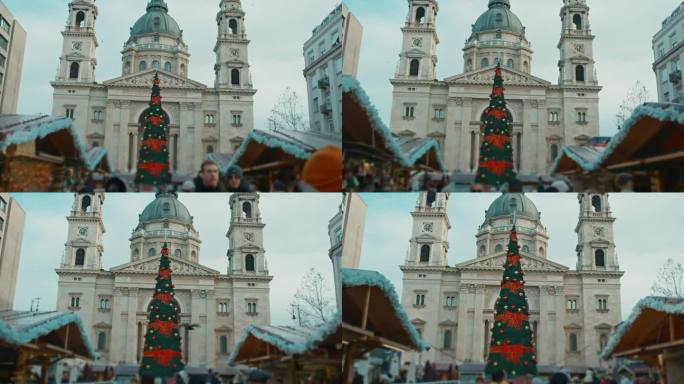 低角度手持拍摄的装饰圣诞树在市场外的圣斯蒂芬大教堂在布达佩斯，匈牙利