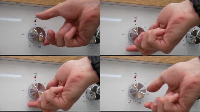特写:一只男性的手转动烤箱的钢旋钮来打开烤箱