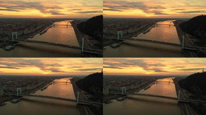 空中无人机拍摄的多瑙河上的伊丽莎白桥在黄昏时在多云的天空，匈牙利布达佩斯
