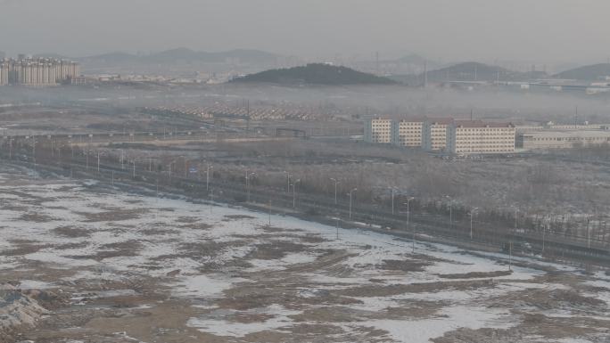 航拍威海市双岛湾四通一平待开发地块雪景