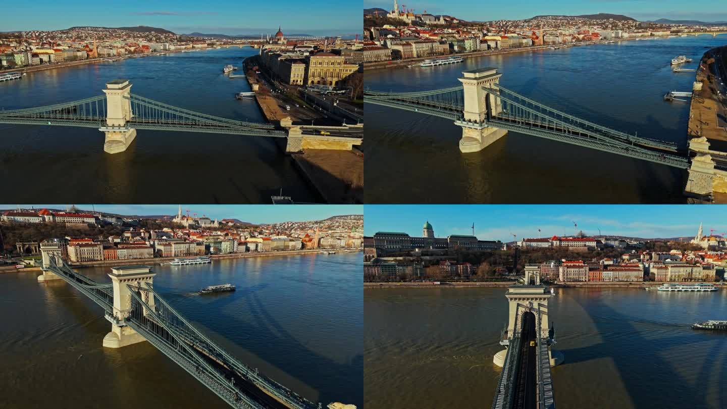 在阳光明媚的日子里，匈牙利历史悠久的布达佩斯城市景观中，多瑙河上的szenjochenyi链桥的空中