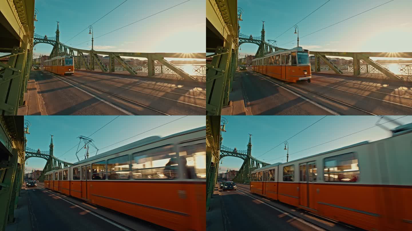 在阳光明媚的一天，匈牙利布达佩斯，有轨电车和汽车在自由桥上移动的手持镜头